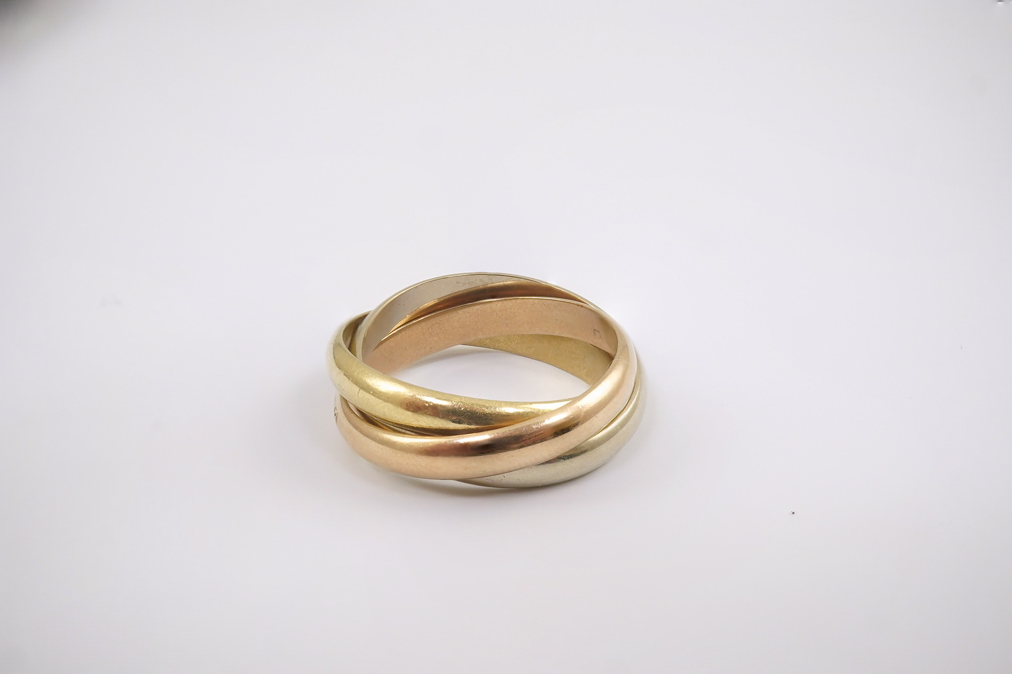 A modern Must De Cartier three colour 18k gold triple band 'Russian' wedding ring